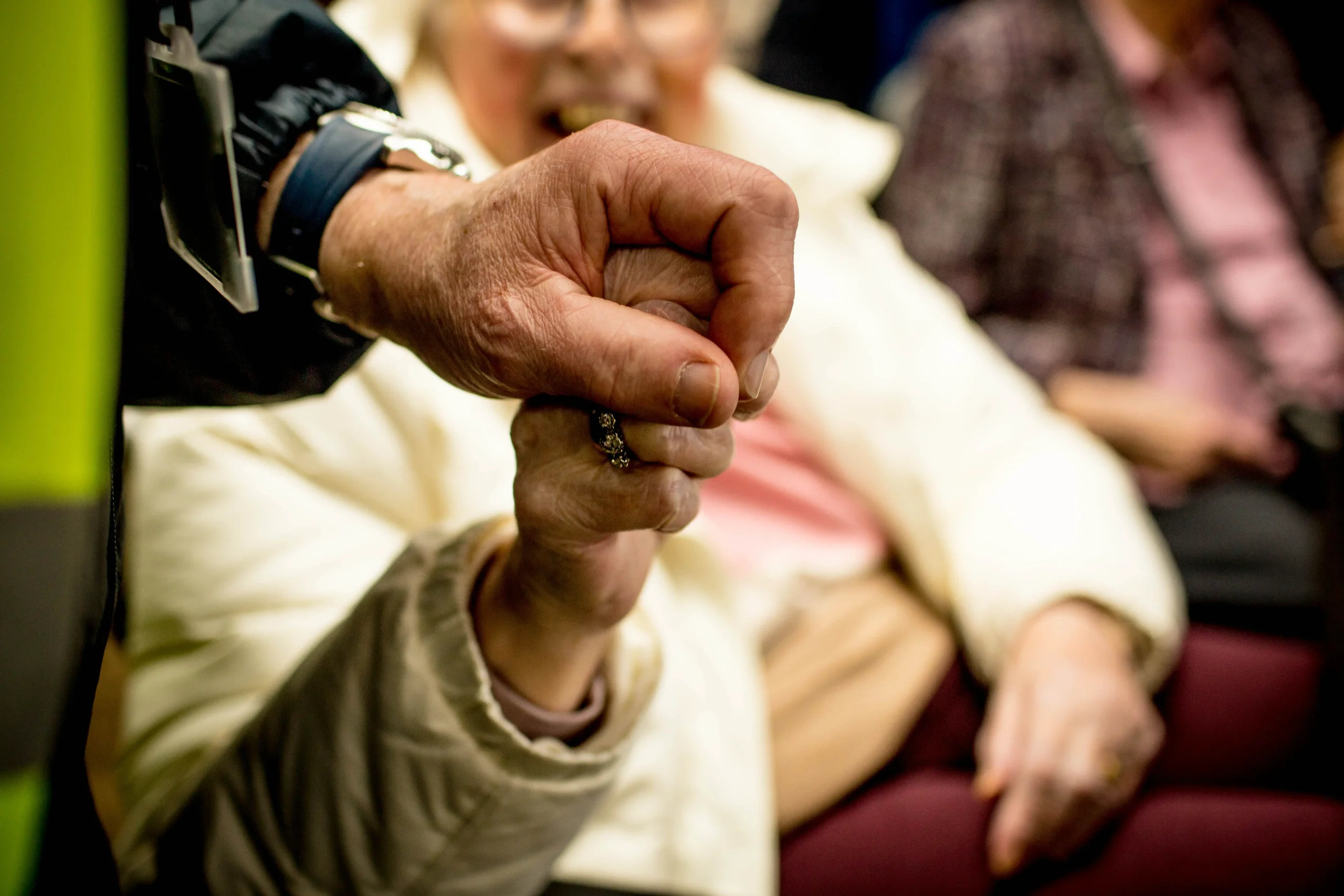 A Community Link volunteer helping a passenger